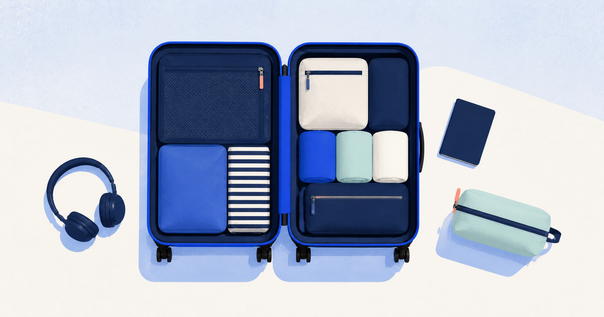 Top-down editorial illustration of an open carry-on neatly packed with cubes, clothing, headphones, and toiletries